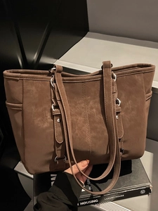 Vintage brown large capacity tote bag with long shoulder straps and metallic hardware details