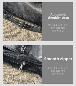 Detail of adjustable metal buckle strap and smooth zipper on vintage denim crossbody bag