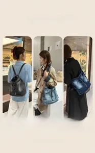 Detailed view of three vintage denim bags showing washed texture and zipper pockets