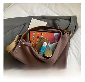 Large capacity tote bag interior showing storage space for tablet and essentials