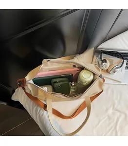 Interior view showing large capacity storage and compartments of canvas tote bag