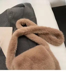 Detail of comfortable brown plush shoulder strap with fluffy faux fur texture on the bag