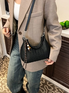 Retro black woven hobo shoulder bag with intricate pleats and wood bead tassel