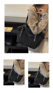 Dettaglio macro della borsa tote in pelle scamosciata nera con cinturini in pelle