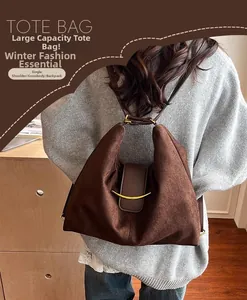 Brown suede tote bag with versatile straps for shoulder and crossbody wear options