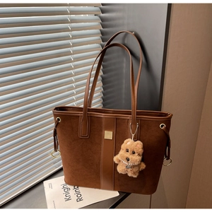 Brown suede patchwork tote bag with metal square buckle and plush bear charm