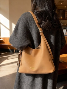 Caramel brown vintage hobo shoulder bag with tassel and adjustable strap for women