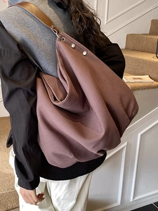 Minimalist large canvas tote bag with leather straps for women commuting and daily use