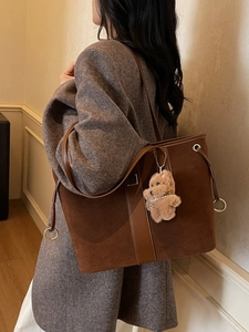 Brown suede tote bag with plush puppy charm for women, chic fall winter shoulder bag style