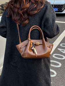 Brown glossy leather handbag with colorful beads and adjustable shoulder strap for women
