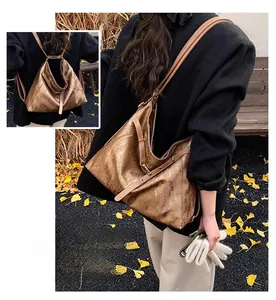 Detail showing versatile metallic brown tote bag in three-way shoulder and backpack styles