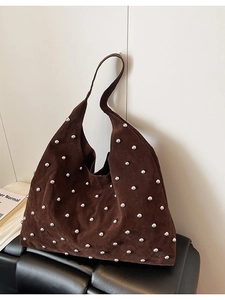 Brown suede hobo shoulder bag with silver rivet details and a spacious design