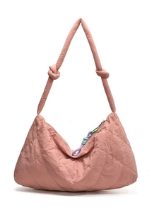 Quilted crescent shoulder bag in light pink nylon with braided zipper detail and knotted strap