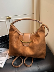 Vintage dark brown suede hobo bag with crescent gold buckle and adjustable strap