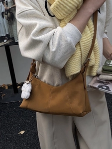 Retro brown oversized shoulder bag with plush bunny charm for autumn style