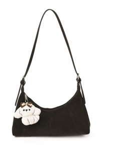 Chic black faux suede crescent shoulder bag with cute plush puppy charm accessory