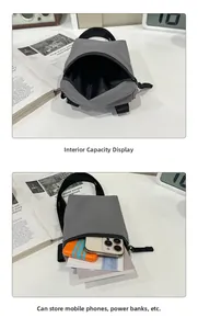 Macro view of grey nylon crossbody phone bag showing storage capacity and zipper detail