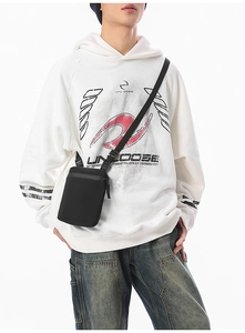 Minimalist black crossbody phone bag with waterproof zipper and adjustable strap on model