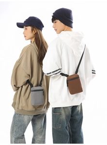 Vertical mini crossbody phone bag in light gray and coffee colors with adjustable strap