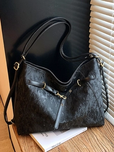 Black textured tote bag with large capacity, dual handles and golden hardware details
