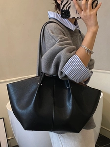Classic black matte leather tote bag with wing design and slender shoulder straps
