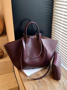 Vintage burgundy leather tote bag set with a matching pouch and adjustable strap