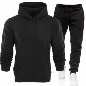 Detail view of black men's hoodie set featuring kangaroo pocket and adjustable drawstring