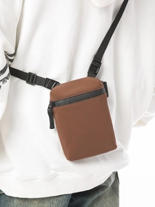 Chic brown crossbody bag with waterproof zipper and adjustable strap for women
