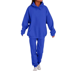 Detail of royal blue hooded tracksuit with kangaroo pocket and drawstring on joggers