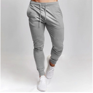 Men's slim fit grey joggers with drawstring elastic waist and tapered ribbed cuffs