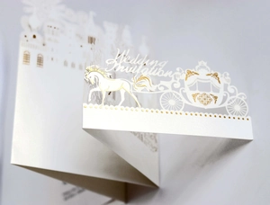 3D pop-up wedding invitation featuring white castle laser cut and gold foil accents
