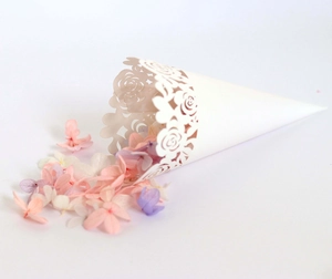 Close-up of elegant laser-cut rose hollow paper petal cones with dried flower petals
