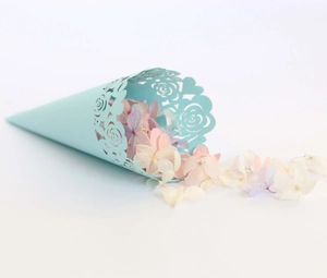 Detail of light blue laser-cut rose paper cone with dried petals for wedding confetti