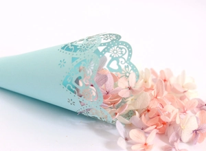 Detail of laser cut heart hollow cone for wedding flower petals in soft blue cardstock