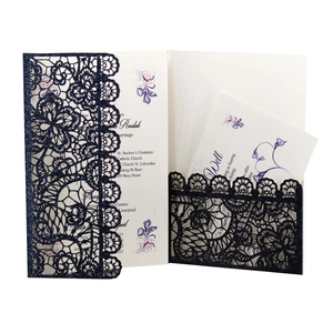 Detailed laser cut navy blue wedding invitation with gold glitter and floral inner card
