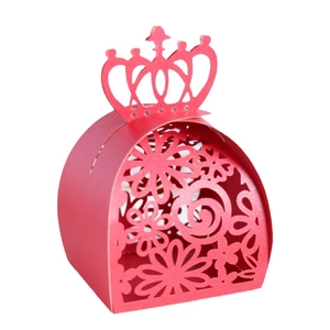 Red laser-cut wedding candy box with elegant floral hollow patterns and crown handle