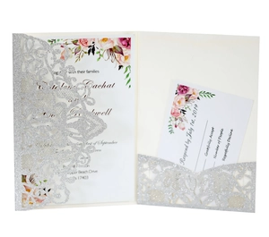 Detail of silver glitter laser-cut pocket with floral wedding invitation and RSVP card set