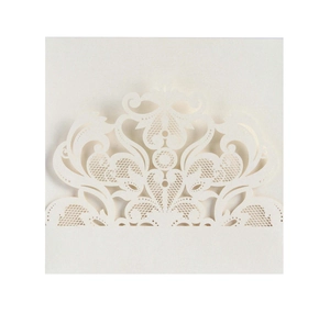 Detail of laser-cut white damask pattern on pearlescent wedding invitation card cover
