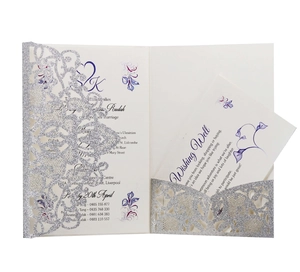 Detailed laser-cut silver glitter wedding invitation with elegant purple floral inner card