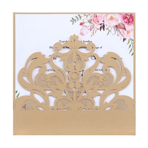 Detailed laser-cut champagne gold lace wedding invitation with pink floral insert card