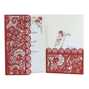 Elegant laser-cut red glitter wedding invitation with floral insert and lace pattern