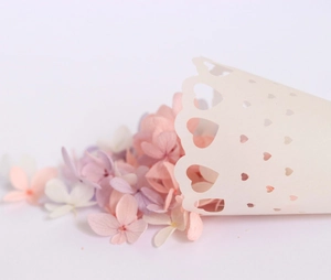 Laser-cut heart hollow paper cone with dried flower petals for wedding confetti toss