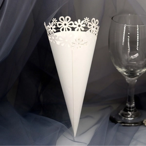 White laser-cut flower petal cones made of paper for wedding confetti and celebrations