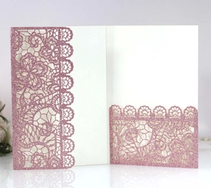 Detail of pink glitter laser-cut lace floral pattern wedding invitation card pocket