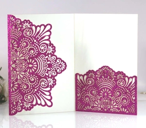 Detailed laser-cut rose red glitter paper invitation cover with intricate mandala patterns