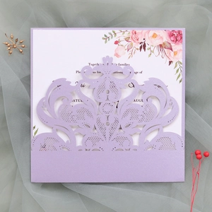 Detailed laser-cut lavender lace invitation set with elegant floral inner card