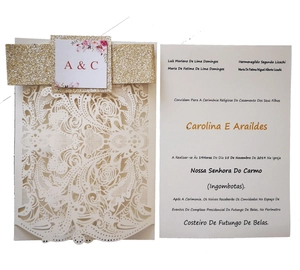 Laser cut ivory wedding invitation with gold glitter band and floral monogram