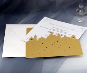 Elegant gold laser-cut castle wedding invitation set with white envelope and inner card