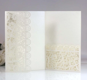 Detailed laser-cut ivory lace wedding invitation card with pearlescent finish and inner pocket