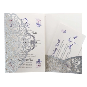Detailed laser cut silver glitter wedding invitation set with floral hollow pattern